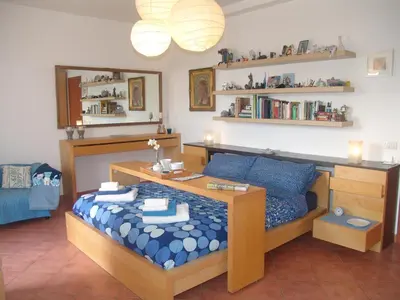 Letto o letti in una camera di Villa Muse Holiday oasi sul mare di CapoMulini, Acireale - Sicilia, Italy Locazione Turistica