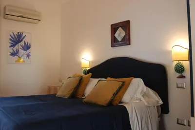 Letto o letti in una camera di Villa delle Palme