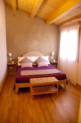 Letto o letti in una camera di B&B Le Antiche Cisterne