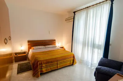 Letto o letti in una camera di Casa Vacanza AcquaMarina