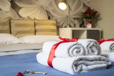 Letto o letti in una camera di RossoCorallo B&B