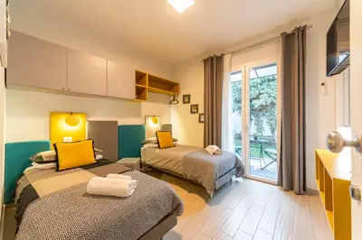Letto o letti in una camera di Dolce Vita