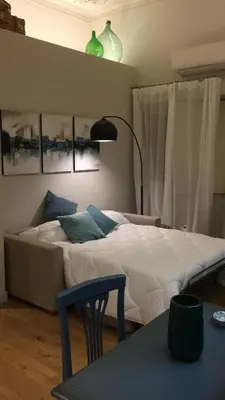 Letto o letti in una camera di Four Elements Apartments