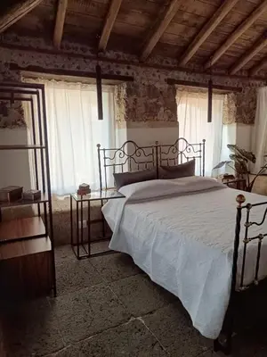 Letto o letti in una camera di Villa Alessio - Case Vacanza con Piscina sull'Etna