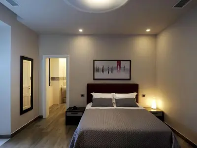 Letto o letti in una camera di Relais Anfitheatro