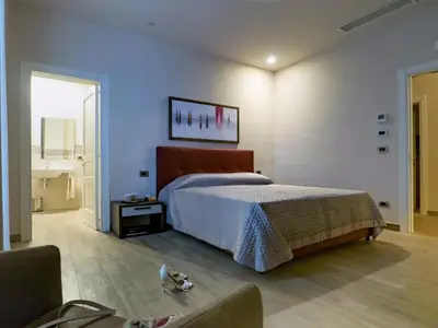 Letto o letti in una camera di Relais Anfitheatro