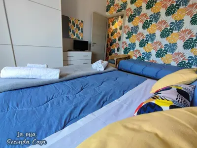 Letto o letti in una camera di La mia seconda casa ad Aci Castello