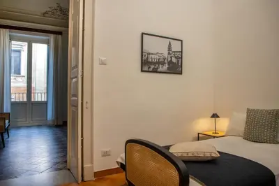 Letto o letti in una camera di La Casa del Gelsomino Palace