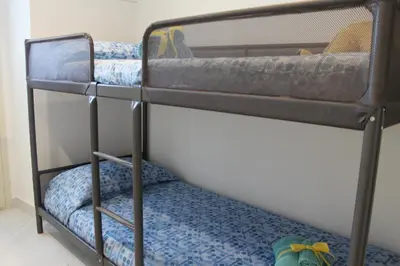 Letto o letti in una camera di Le case di Carlotta & Giorgia