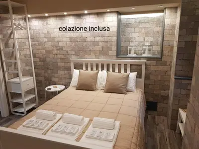 Letto o letti in una camera di VENTIMIGLIA SUITE & WINE