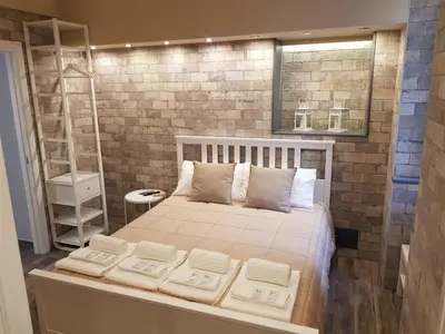 Letto o letti in una camera di VENTIMIGLIA SUITE & WINE