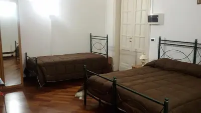 Letto o letti in una camera di B&B Alba