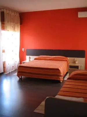 Letto o letti in una camera di B&B 5 Sensi