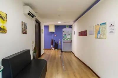 Area soggiorno di Catania Crossing B&B - Rooms & Comforts