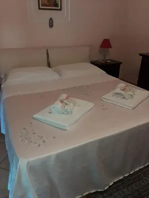 Letto o letti in una camera di Casa vacanze ETNA COCUS