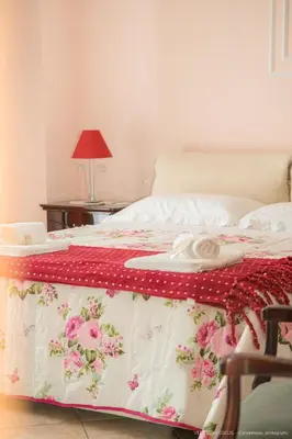 Letto o letti in una camera di Casa vacanze ETNA COCUS