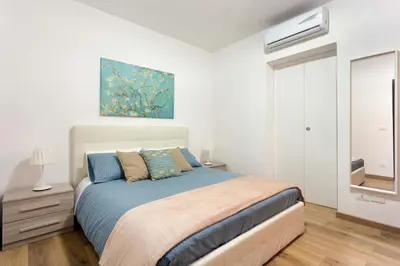 Letto o letti in una camera di Centre Apartment Grotte Bianche 2