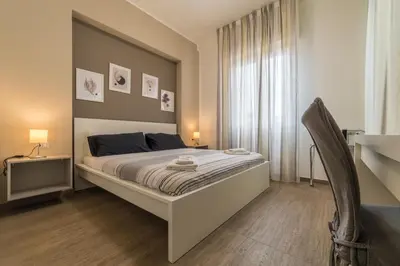 Letto o letti in una camera di Ambasciatori B&B