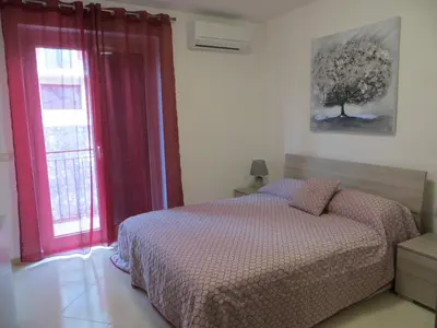 Letto o letti in una camera di Villa Leonardi