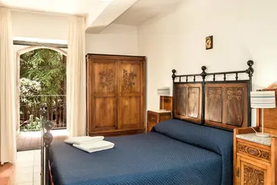Letto o letti in una camera di Casale Poggio del Tiglio