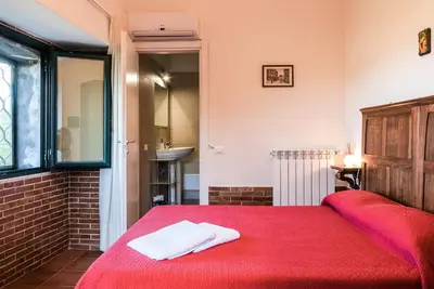 Letto o letti in una camera di Casale Poggio del Tiglio