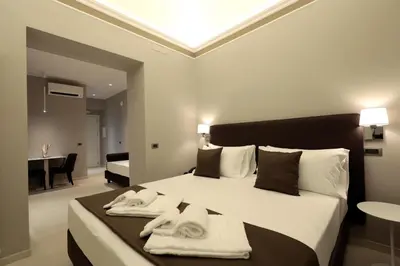 Letto o letti in una camera di ETNEA STYLE CATANIA LUXURY ROOMS