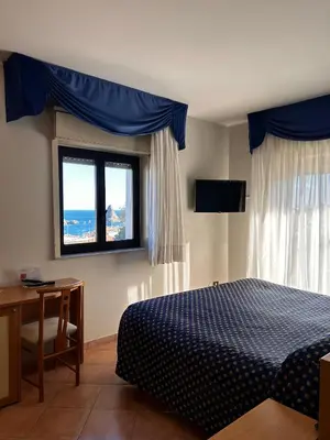 Letto o letti in una camera di Hotel Lachea