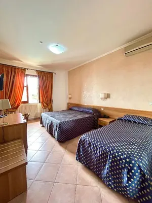 Letto o letti in una camera di Hotel Lachea