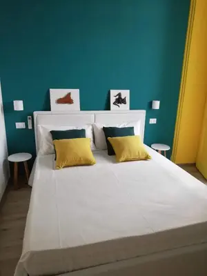 Letto o letti in una camera di GH Rooms Catania