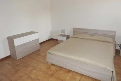 Letto o letti in una camera di Mansarda sul mare dei Ciclopi