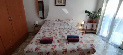 Letto o letti in una camera di At Claudio and Inna's Home