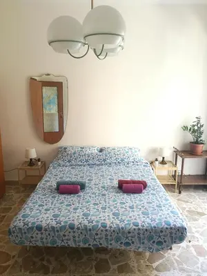 Letto o letti in una camera di At Claudio and Inna's Home