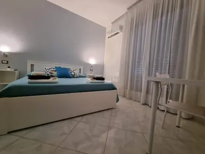Letto o letti in una camera di B&B TERRA DI MITI