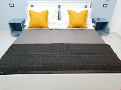 Letto o letti in una camera di B&B TERRA DI MITI