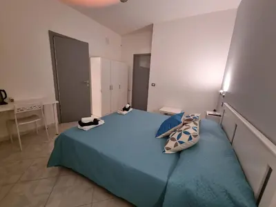 Letto o letti in una camera di B&B TERRA DI MITI