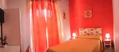 Letto o letti in una camera di Mariclà