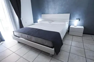 Letto o letti in una camera di B&B Corso Italia 92