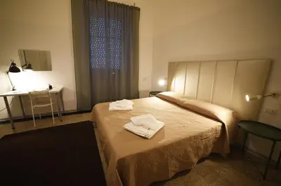 Letto o letti in una camera di TIFEO Bed & Breakfast