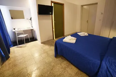 Letto o letti in una camera di TIFEO Bed & Breakfast