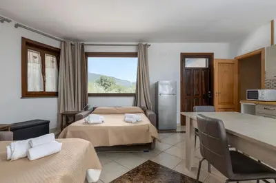 Letto o letti in una camera di Villa Vulcano, tra l'Etna e il mare