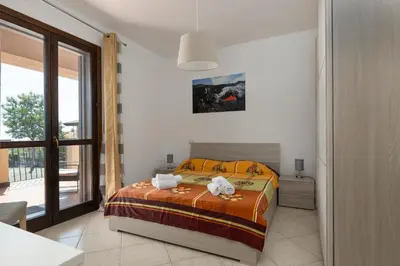 Letto o letti in una camera di Villa Vulcano, tra l'Etna e il mare