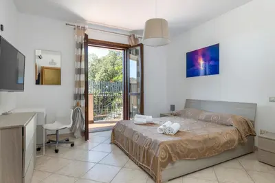 Letto o letti in una camera di Villa Vulcano, tra l'Etna e il mare