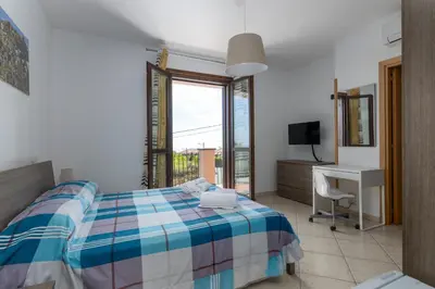Letto o letti in una camera di Villa Vulcano, tra l'Etna e il mare