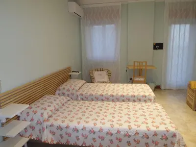 Letto o letti in una camera di b&b aurora