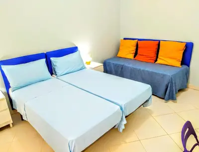 Letto o letti in una camera di Hello B&B