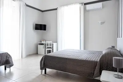 Letto o letti in una camera di Hotel Costanza