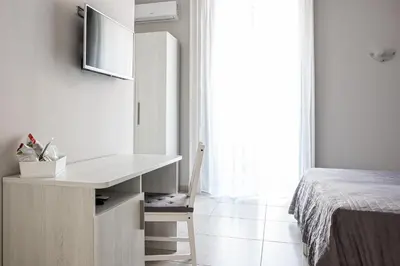 Letto o letti in una camera di Hotel Costanza