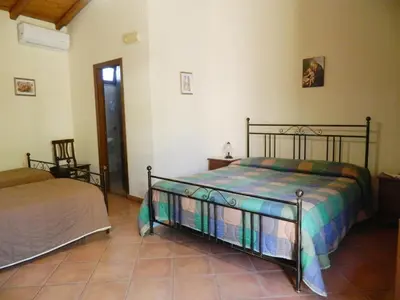 Letto o letti in una camera di Agriturismo La Grevillea