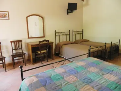 Letto o letti in una camera di Agriturismo La Grevillea