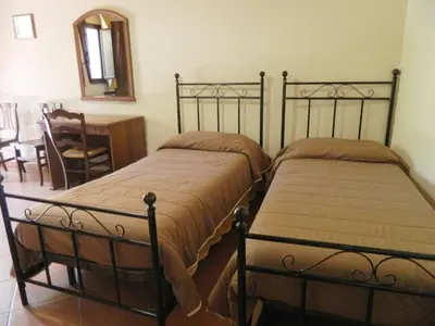 Letto o letti in una camera di Agriturismo La Grevillea